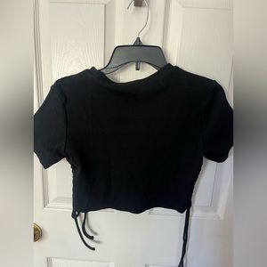 Black crop top with side ties in excellent condition
